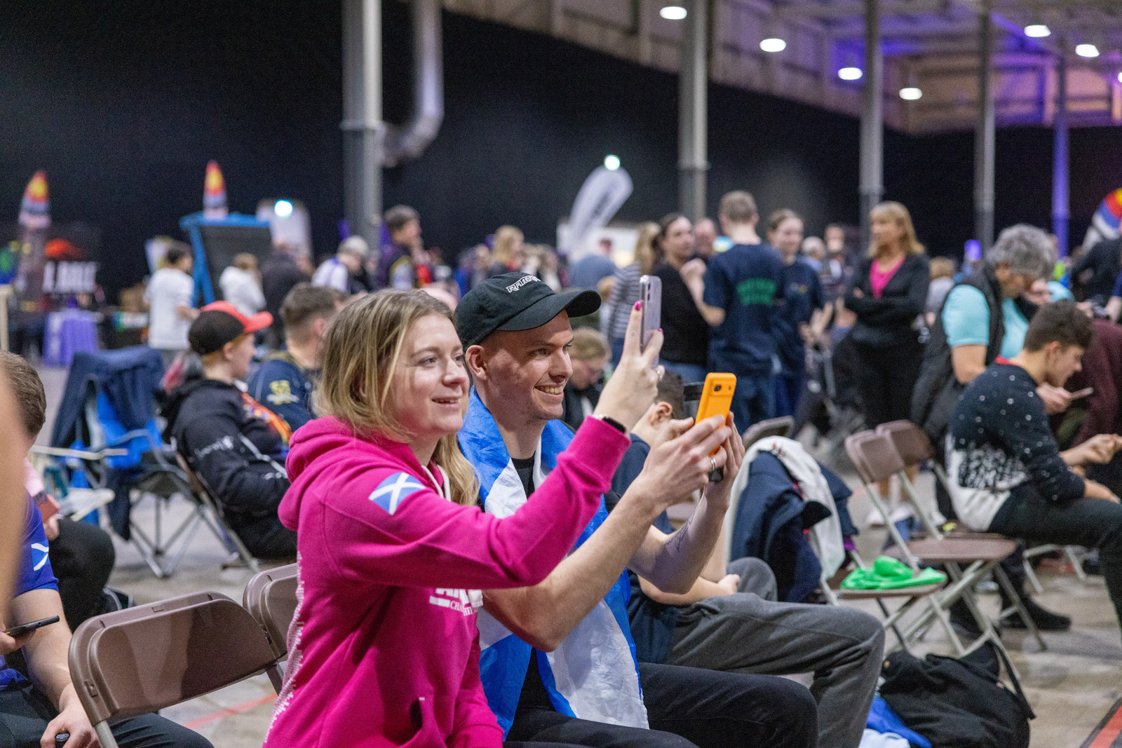 Archery parents watching the shooting at a competition