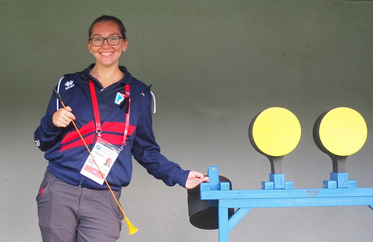 Staff member standing next to knock down targets