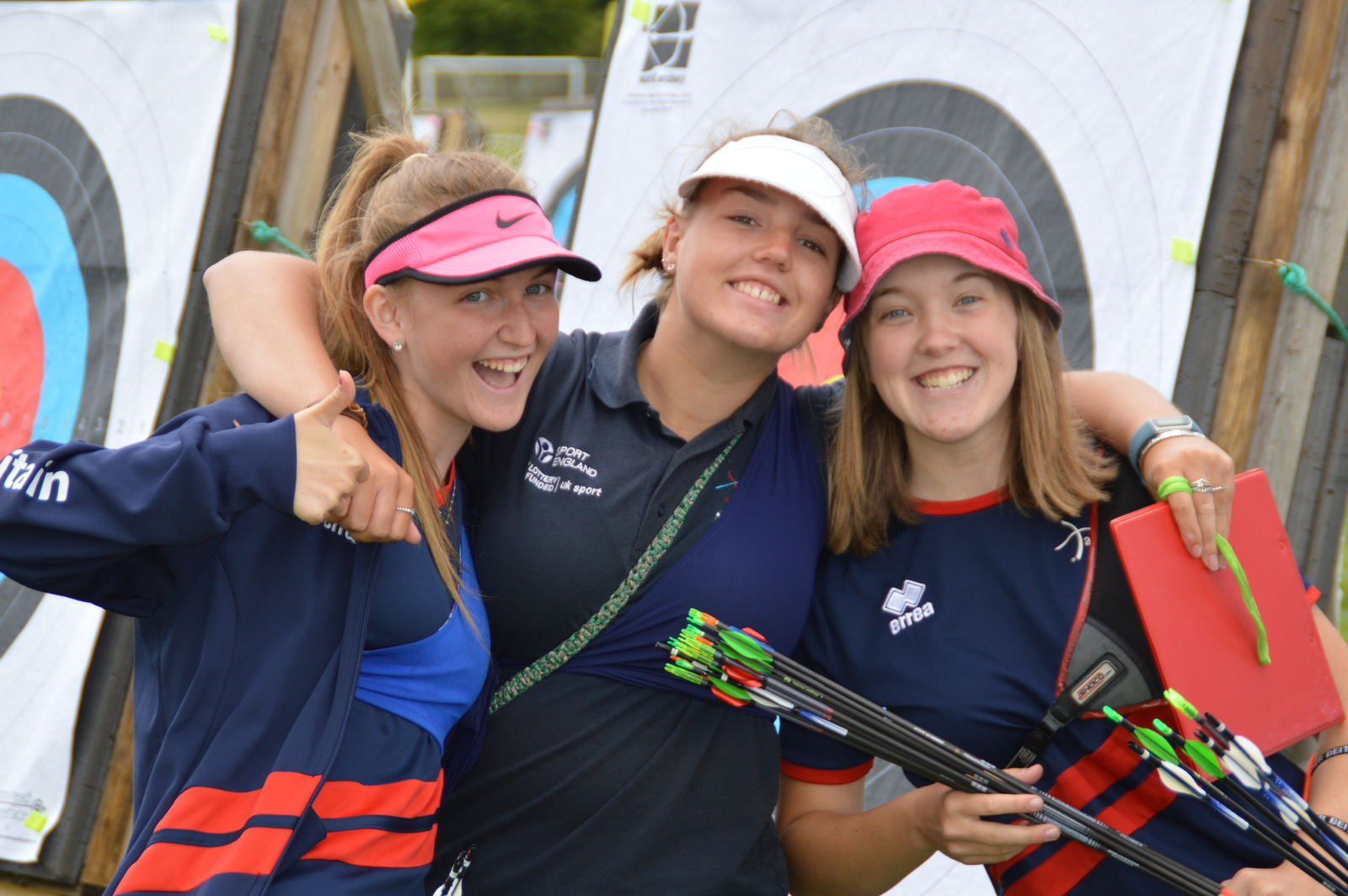 Three archer smiling at the camera